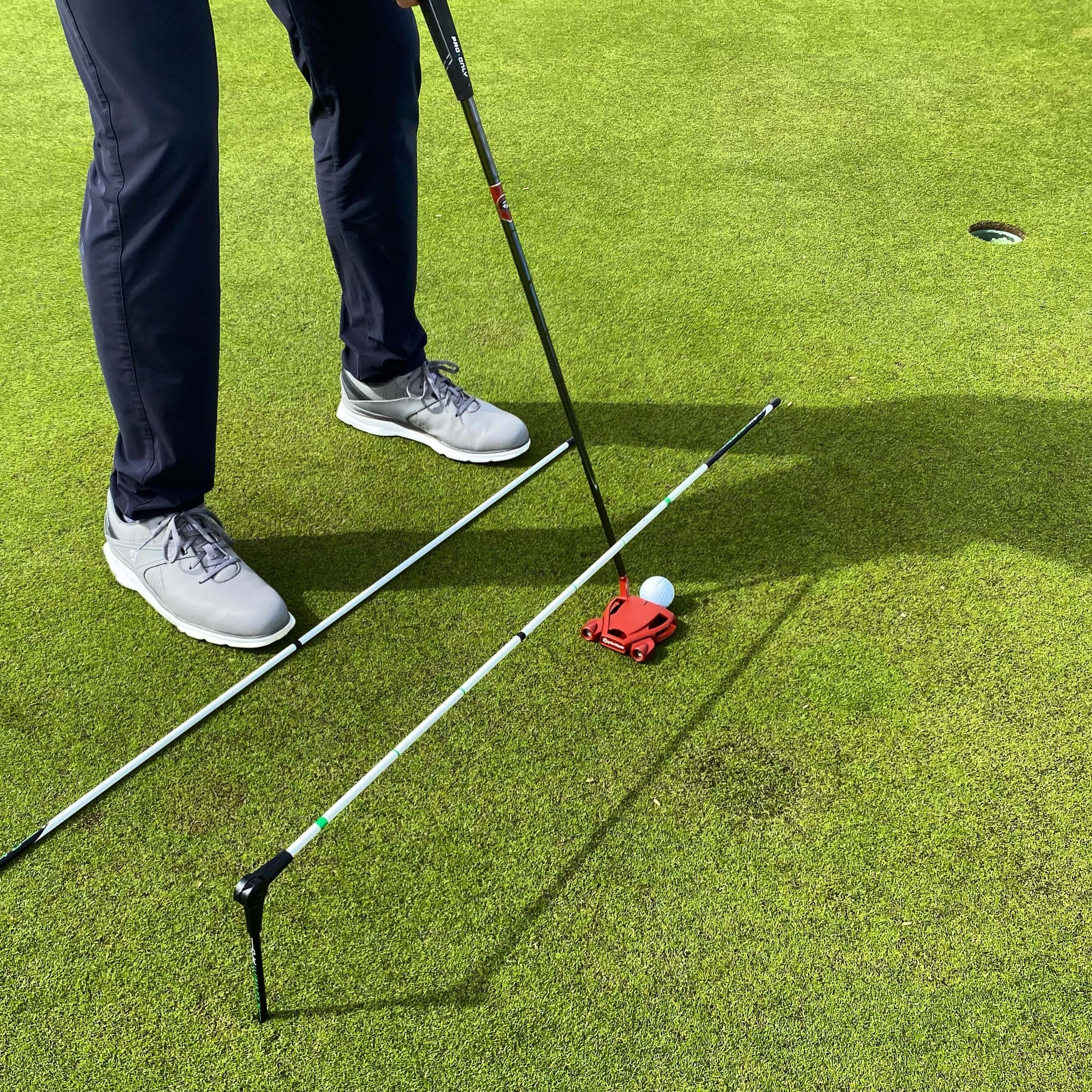golf putting aid for long irons, wedge play, putting and driving the golf ball. Alignment is one of the key fundamentals in golf. buy a single hinge alignment hinge with a straight alignment stick for a powerful multi use golf training aid